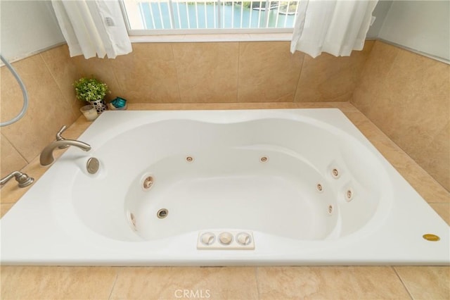 bathroom featuring a relaxing tiled tub