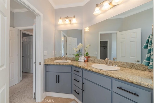 bathroom with vanity and ornamental molding