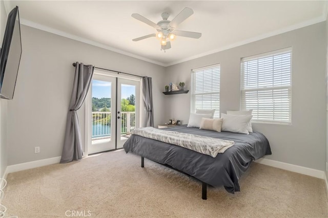 bedroom with crown molding, light colored carpet, access to exterior, and ceiling fan