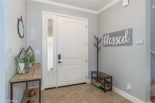 tiled entrance foyer with crown molding