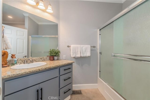 bathroom featuring tile patterned flooring, bath / shower combo with glass door, ornamental molding, and vanity