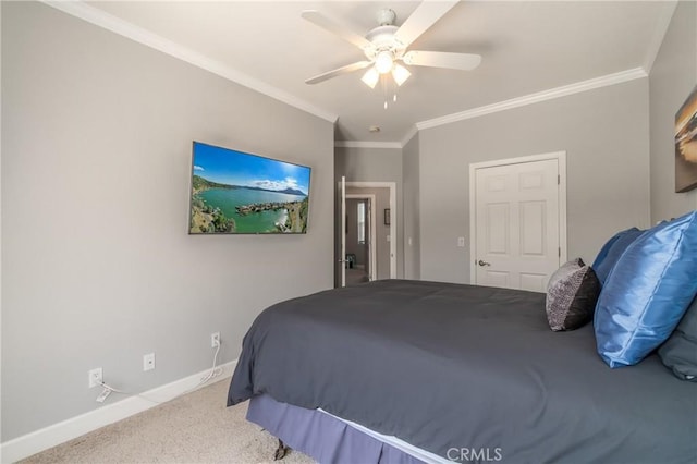 carpeted bedroom featuring ornamental molding and ceiling fan