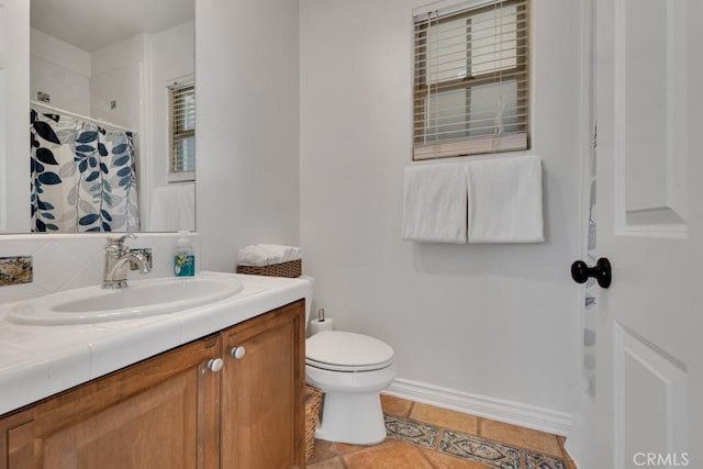 bathroom with tile patterned flooring, vanity, a shower with shower curtain, and toilet