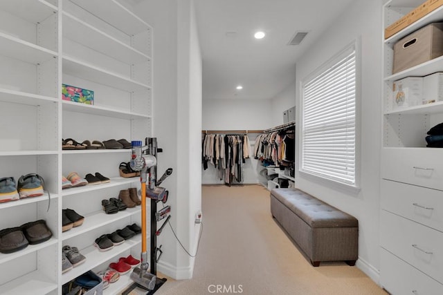 spacious closet featuring visible vents and carpet
