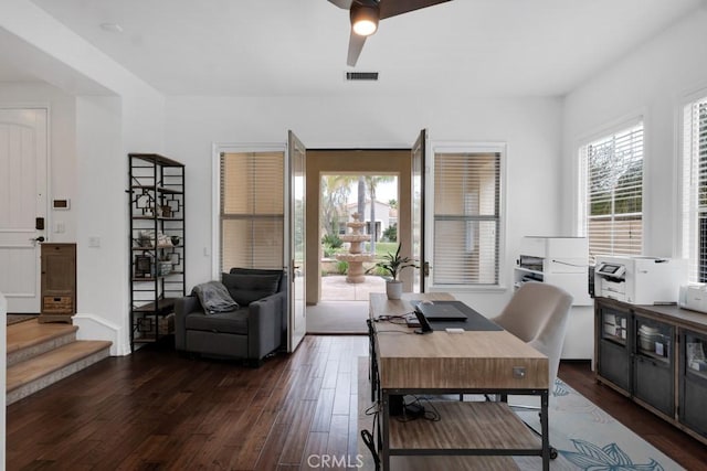 office area with a ceiling fan, dark wood-style flooring, and visible vents