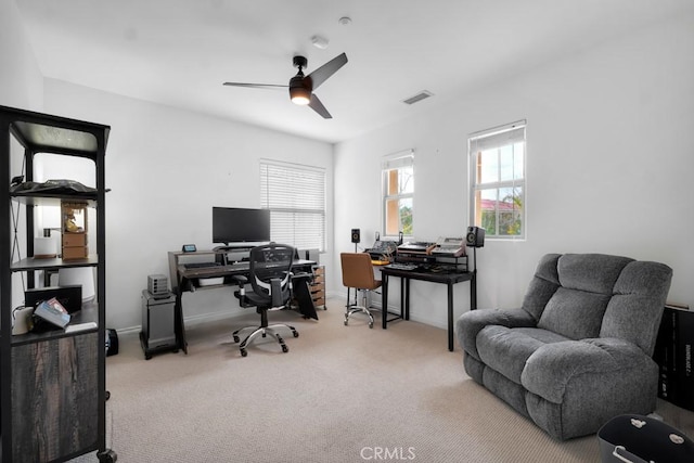 office with ceiling fan and light carpet