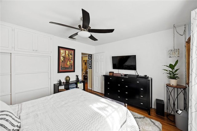 bedroom with ceiling fan and wood finished floors