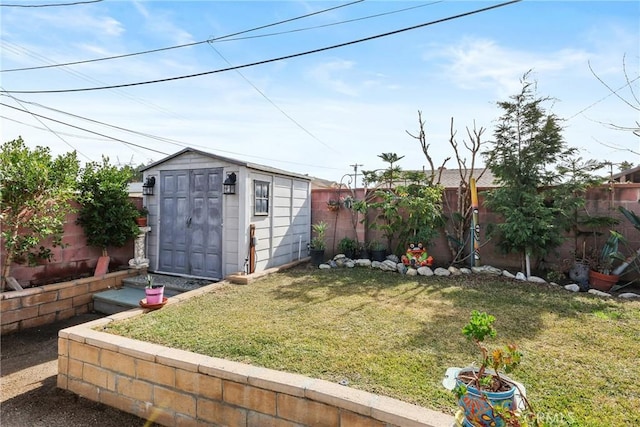 view of yard with a fenced backyard, an outdoor structure, and a shed