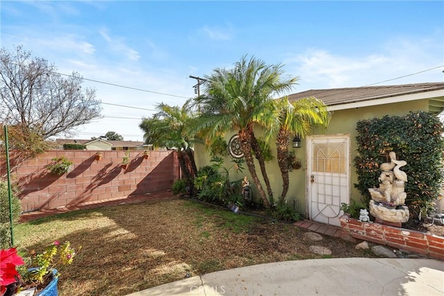 view of yard featuring fence