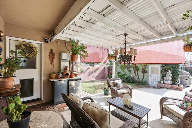 view of patio / terrace with an outdoor hangout area, area for grilling, and fence