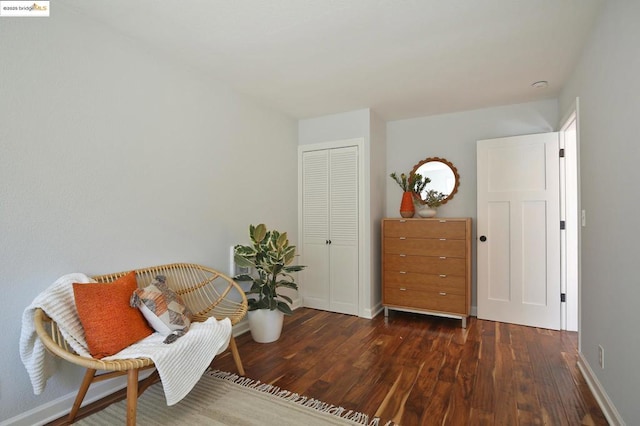 sitting room with dark hardwood / wood-style floors