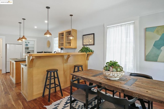 dining space featuring dark hardwood / wood-style flooring