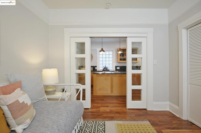 sitting room featuring dark hardwood / wood-style flooring