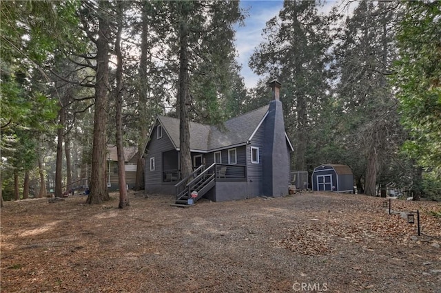 view of front of property featuring a storage unit