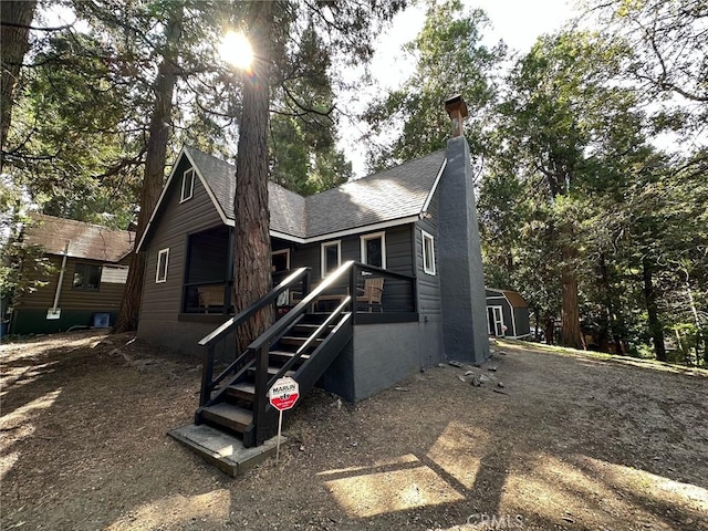 view of front facade with a storage unit