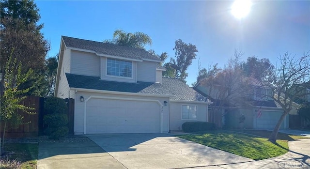 view of front property with a garage and a front lawn