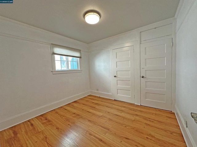 interior space with light hardwood / wood-style flooring and a closet