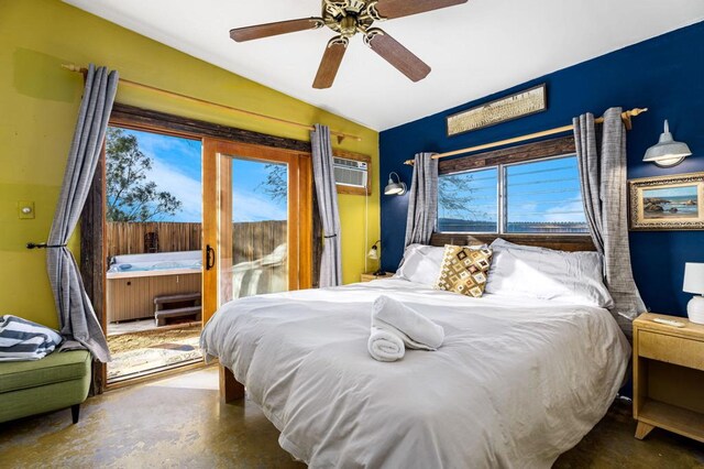 bedroom with a wall mounted air conditioner, access to outside, concrete floors, and ceiling fan