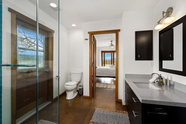 bathroom with vanity, concrete floors, toilet, and walk in shower