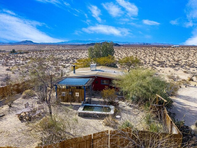 back of property featuring a mountain view