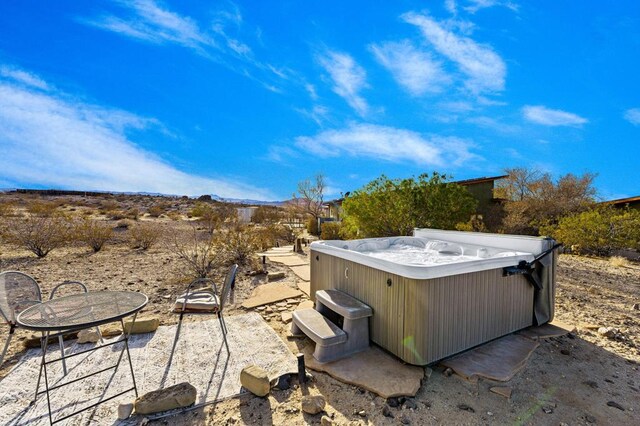 view of patio / terrace featuring a hot tub