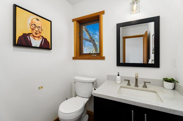 bathroom with vanity and toilet