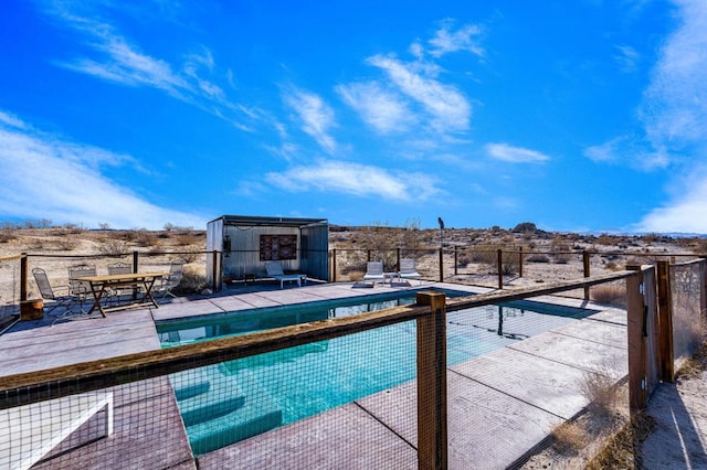 view of swimming pool featuring a patio