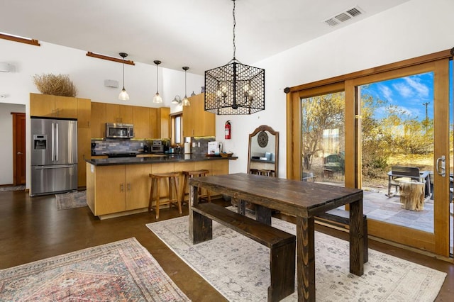 dining room with an inviting chandelier and a wealth of natural light