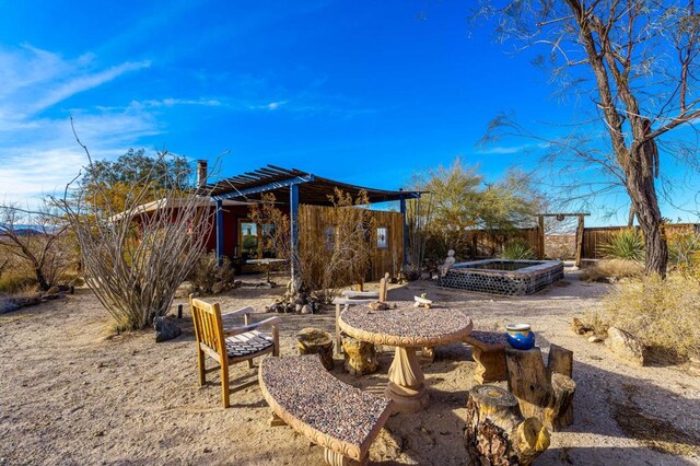 exterior space featuring a hot tub