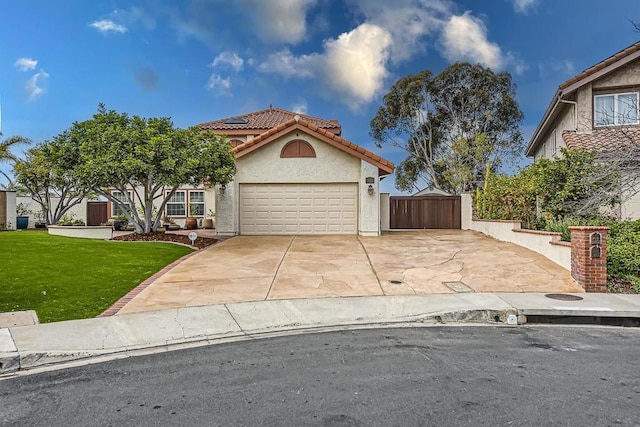 view of front facade with a garage and a front lawn