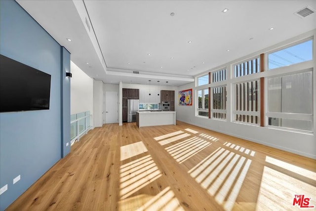 unfurnished living room featuring light hardwood / wood-style floors