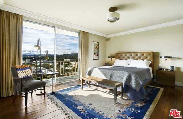 bedroom featuring crown molding, access to exterior, and dark wood-type flooring