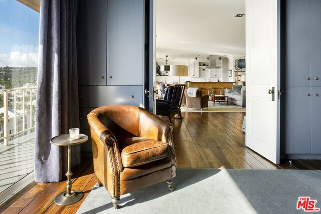 living area with dark hardwood / wood-style floors