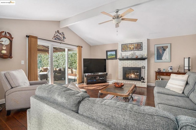 living room featuring ceiling fan, dark hardwood / wood-style flooring, lofted ceiling with beams, and a fireplace