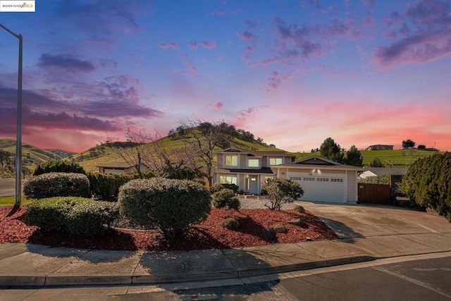 view of front of home featuring a garage and a mountain view