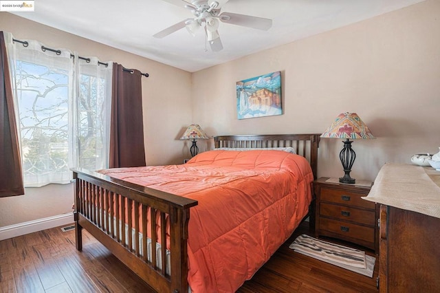 bedroom featuring ceiling fan and dark hardwood / wood-style flooring