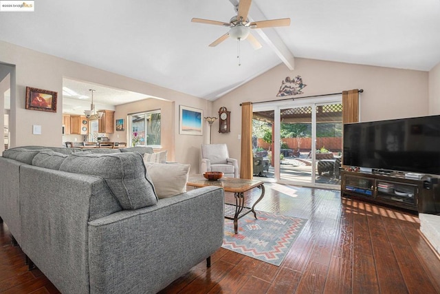 living room with vaulted ceiling with beams, hardwood / wood-style flooring, and ceiling fan with notable chandelier