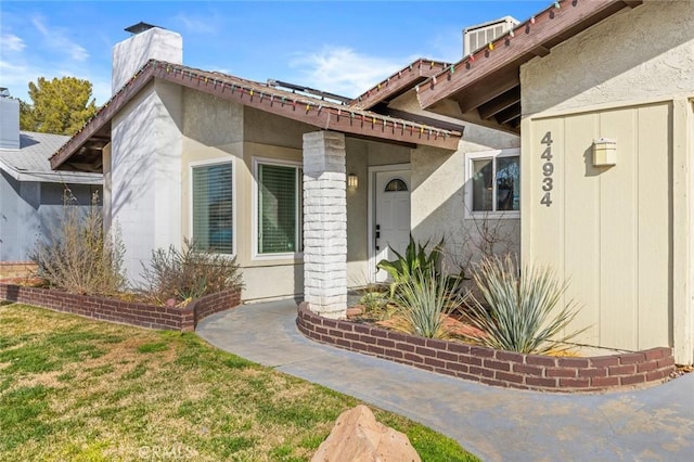 entrance to property with a yard