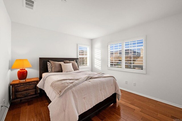 bedroom featuring dark hardwood / wood-style flooring