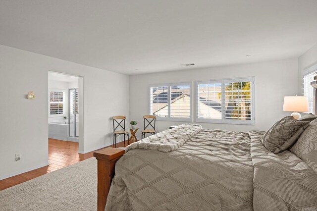 bedroom with light hardwood / wood-style floors