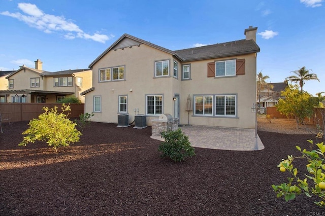 rear view of house featuring a patio area and central air condition unit