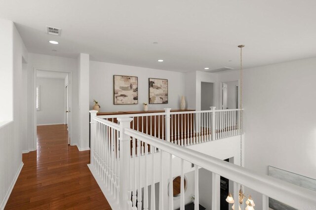 hall with dark hardwood / wood-style flooring