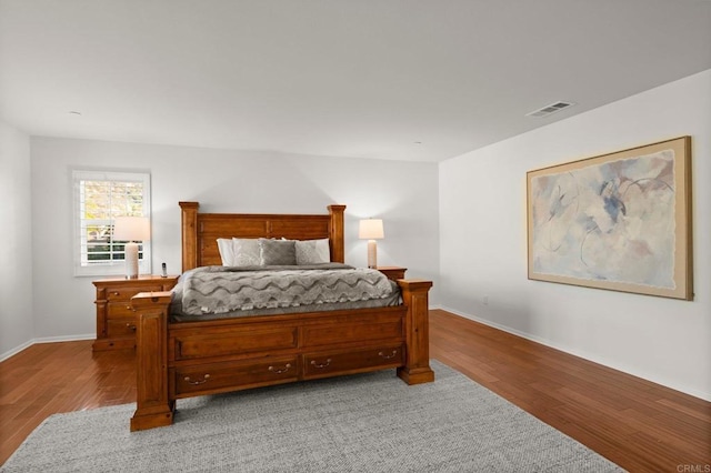 bedroom with wood-type flooring