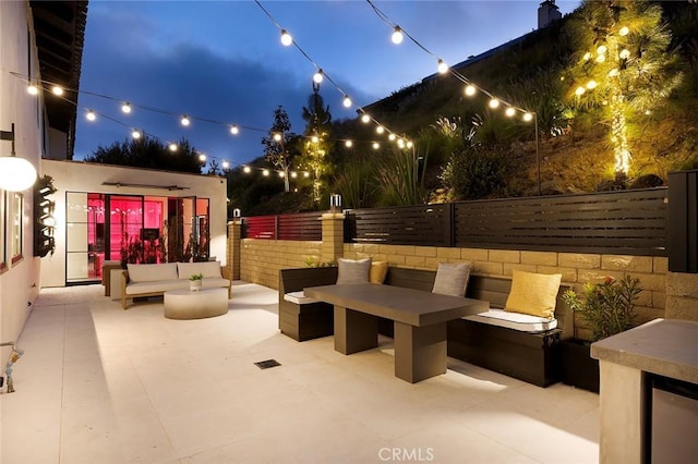 23241 Tasmania Cir, Dana Point, CA 92629 - patio at twilight featuring a patio and an outdoor hangout area