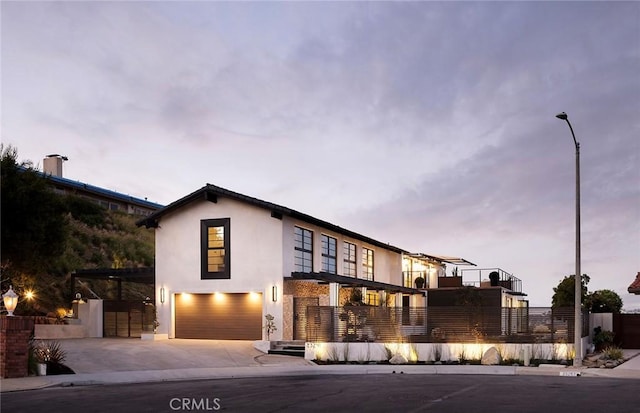 23241 Tasmania Cir, Dana Point, CA 92629 - contemporary home featuring a garage, stucco siding, and concrete driveway
