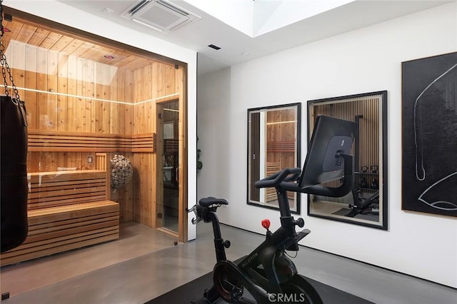 workout room featuring a skylight