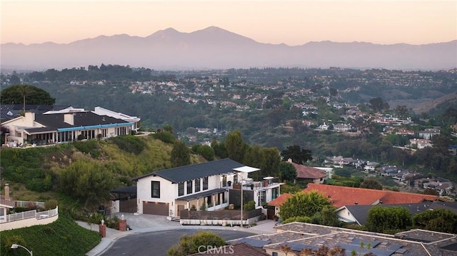 aerial view at dusk with a mountain view