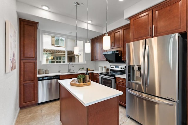 kitchen featuring sink, decorative light fixtures, a center island, ventilation hood, and stainless steel appliances