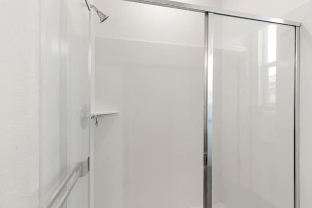 bathroom featuring an enclosed shower