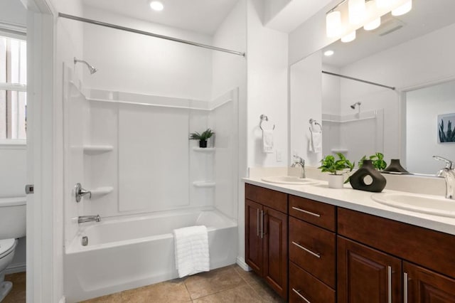 full bathroom featuring vanity, tile patterned floors, bathing tub / shower combination, and toilet